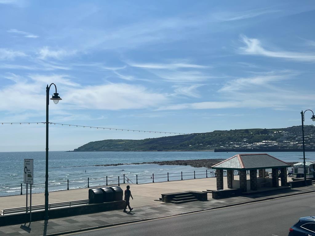 Lot: 144 - COMMERCIAL PROPERTY WITH THREE SELF-CONTAINED LETTING UNITS ENJOYING SEA VIEWS - View from Zelah's apartment living room looking towards Newlyn and Mousehole